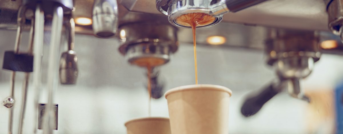 professional-coffee-machine-with-dripping-espresso-in-cafe.jpg